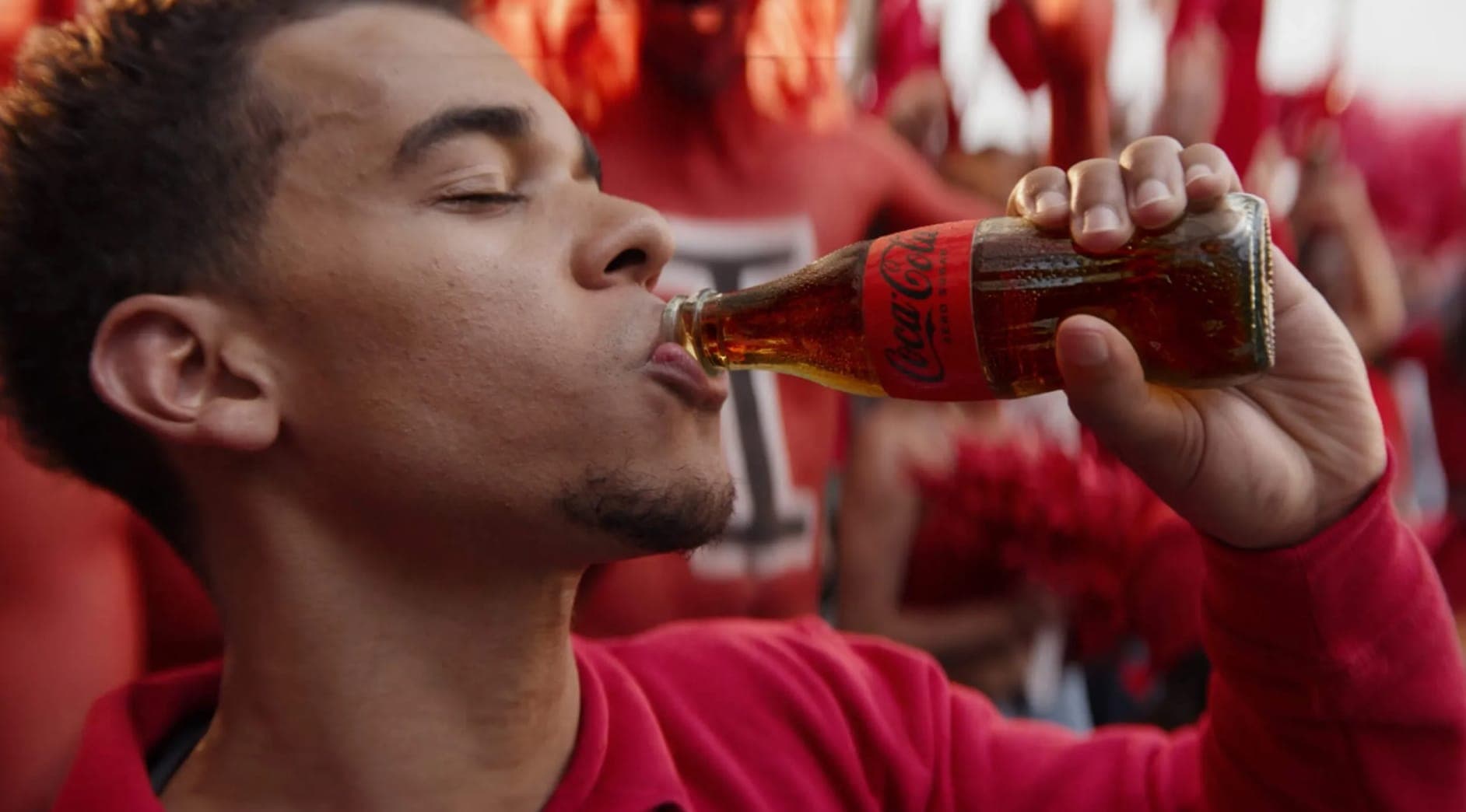 Man Drinks Coca Cola